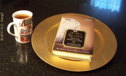 Serving up some tasty tea reading on a gold-colored platter Serving up some tasty tea reading on a gold-colored platter