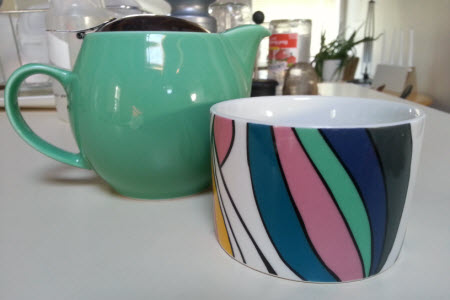 My borrowed teawares: a Bee House teapot and colourful little mug (photo is mine). My borrowed teawares: a Bee House teapot and colourful little mug (photo is mine).