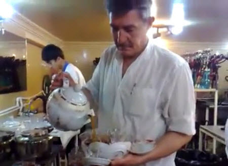 From an amazing video of a waiter in a tea house in Iran – click the photo to go to the YouTube page and watch.