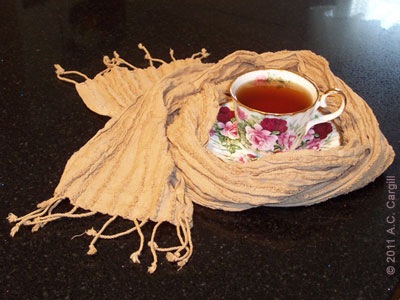 Even your teacups can sport some offbeat tea time fashion! (Tea dyed scarf from CrafTea Designs. Photo source: A.C. Cargill, all rights reserved) Even your teacups can sport some offbeat tea time fashion! (Tea dyed scarf from CrafTea Designs. Photo source: A.C. Cargill, all rights reserved)