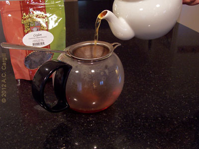 Pouring the tea. (Photo source: The English Tea Store) Pouring the tea. (Photo source: The English Tea Store)