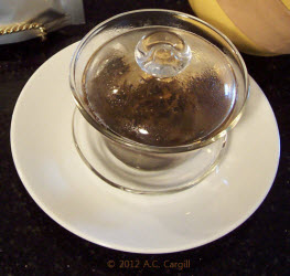 A glass gaiwan had the advantage of providing quite a show and the disadvantage of getting too hot to handle. (Photo source: A.C. Cargill, all rights reserved)