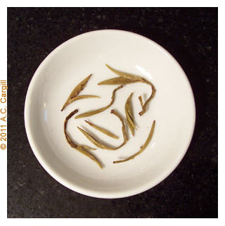 Dragon Pearl after steeping shows the delicate leaf-bud combos that took so much patience to harvest and processs. (Photo source: A.C. Cargill, all rights reserved)