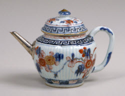 Teapot with replaced spout. (Photo source: screen capture from site)