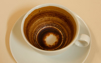 Artist Rona Smith examines the stained teacup as art! (Screen capture from site)