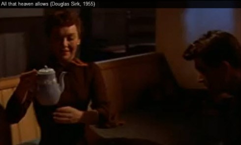 Cary Scott (Jane Wyman) holds the Wedgwood teapot pieced back together by Ron Kirby (Rock Hudson) as a symbol of their solidifying relationship. (Screen capture from site)